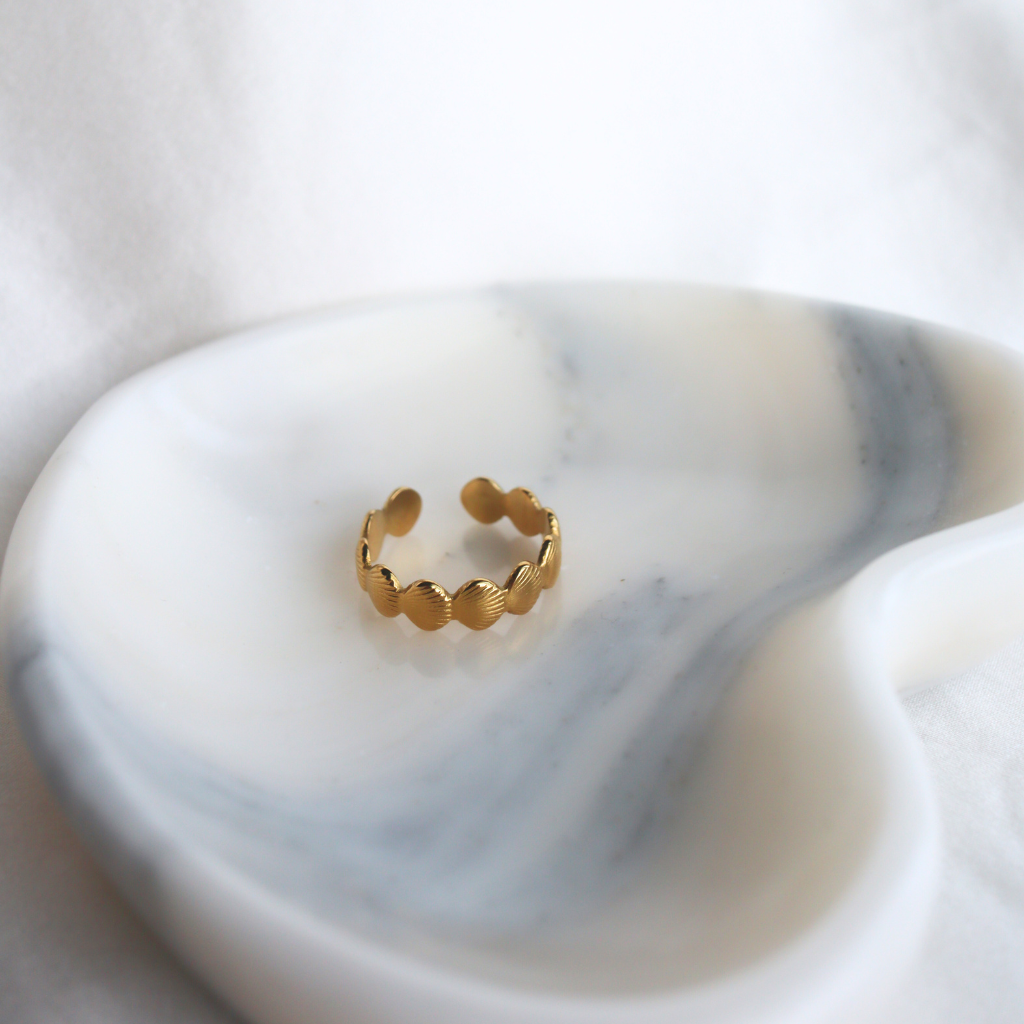Gold ring on a marble surface